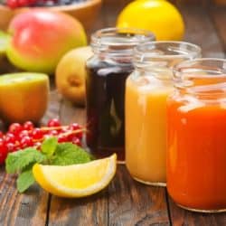 three homemade juices in jars ready to be consumed