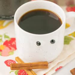 coffee in a mug with goggly eyes