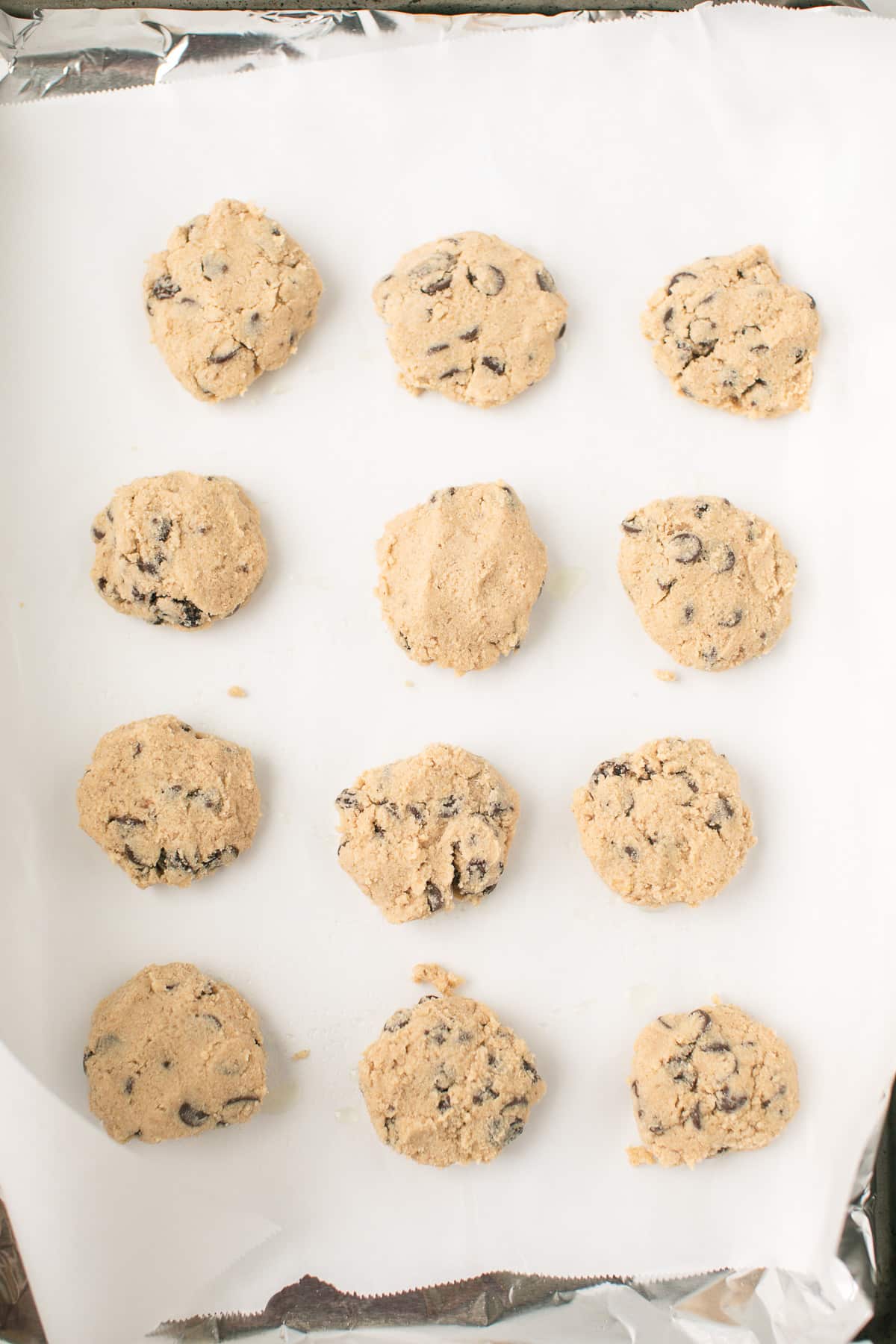 cassava cookies on a baking sheet ready to go into the oven.