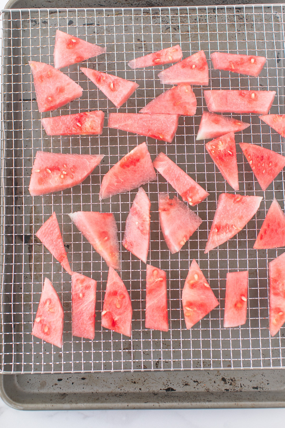 watermelon slices on a dehydrator sheet