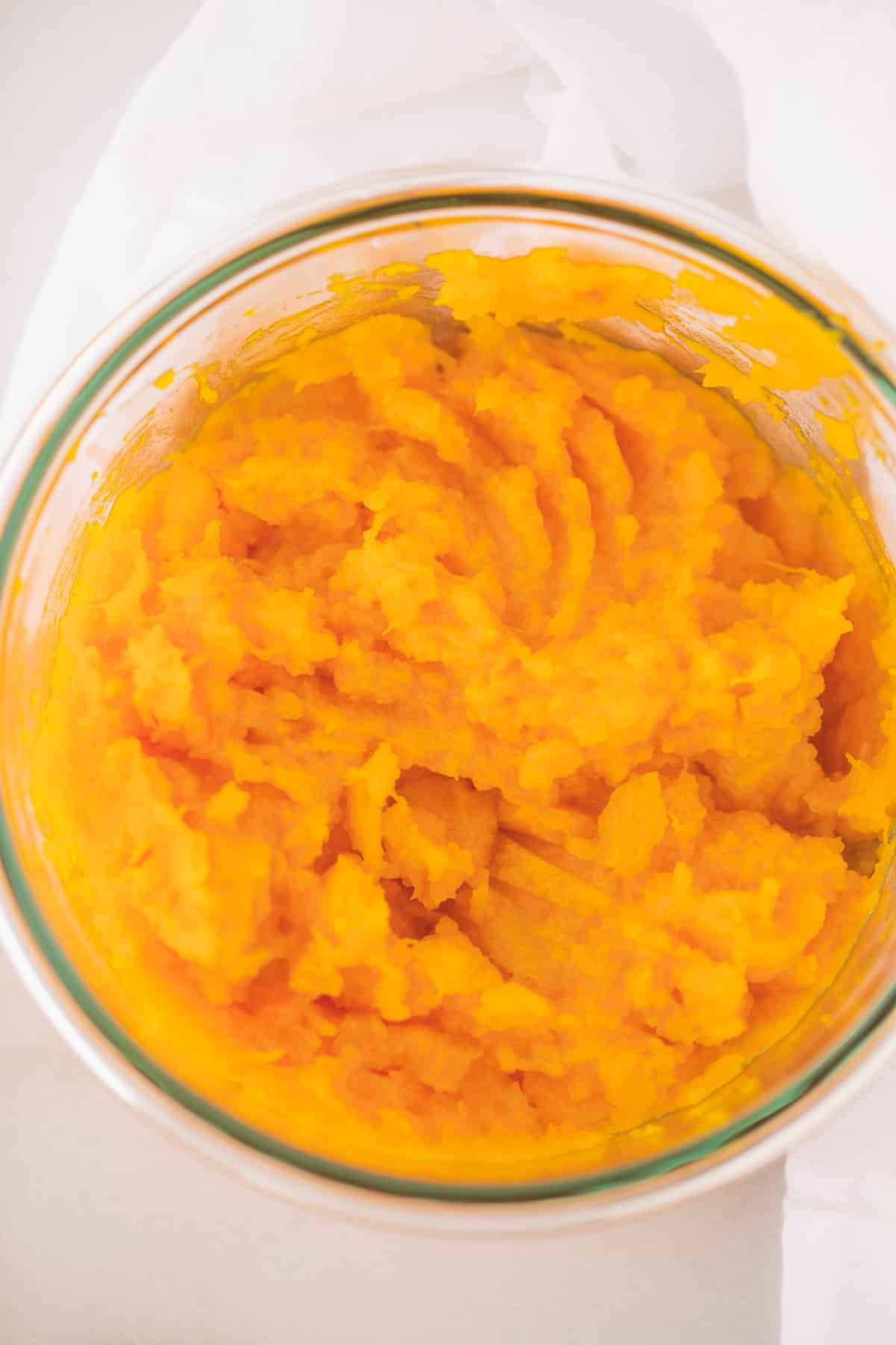 kabocha squash cooked puree in a glass bowl