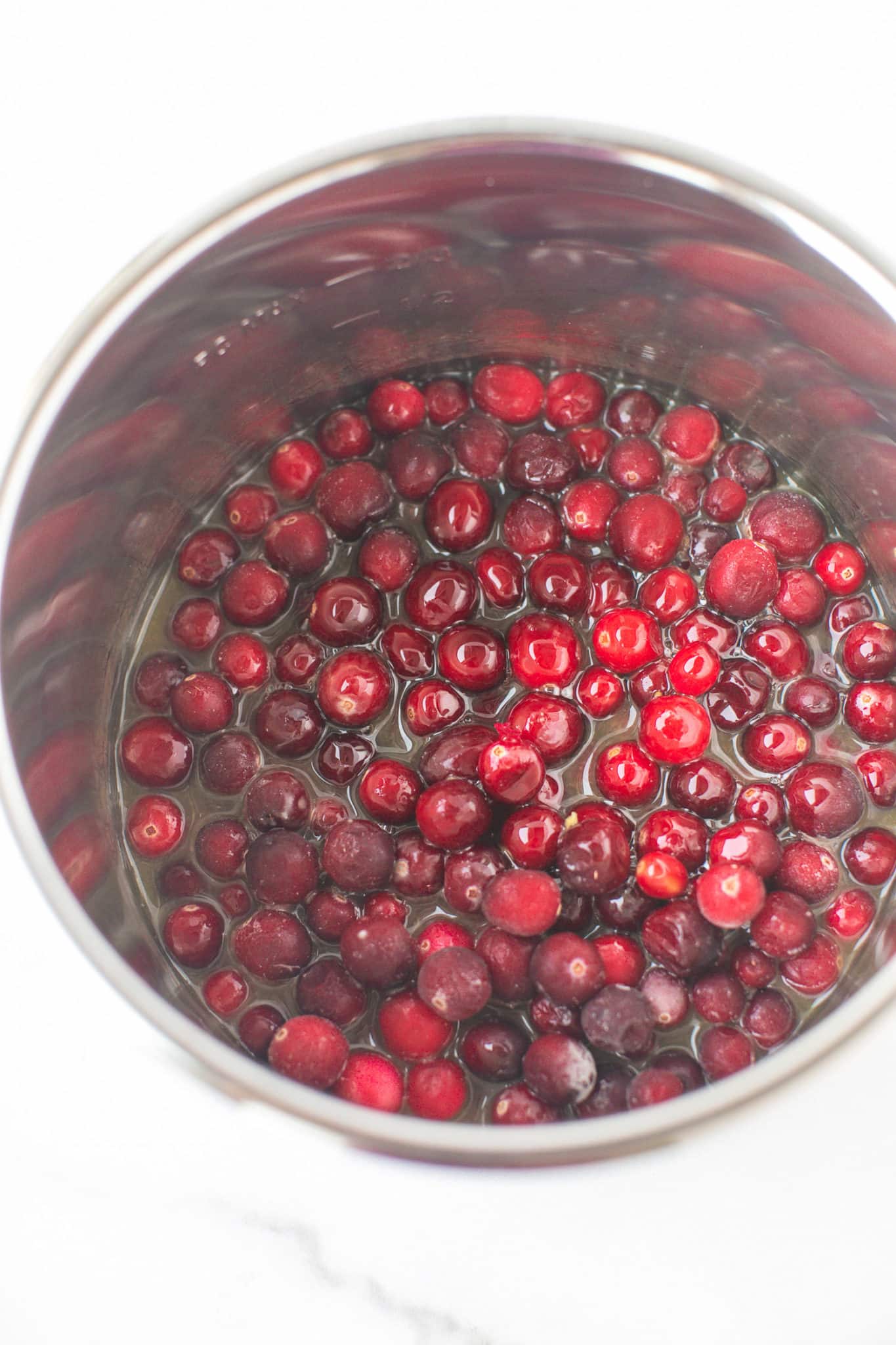 ingredients for instant pot cranberry sauce in an instant pot.