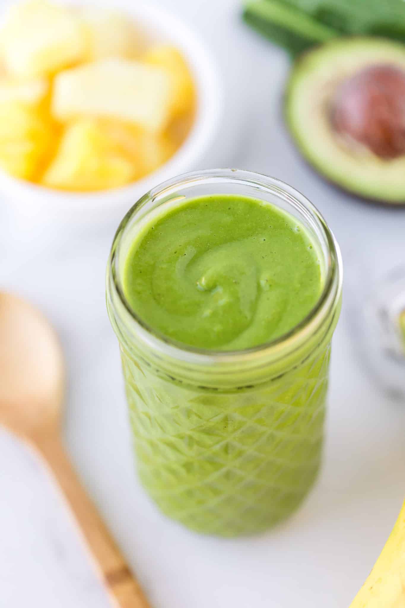 green smoothie served in a clear glass