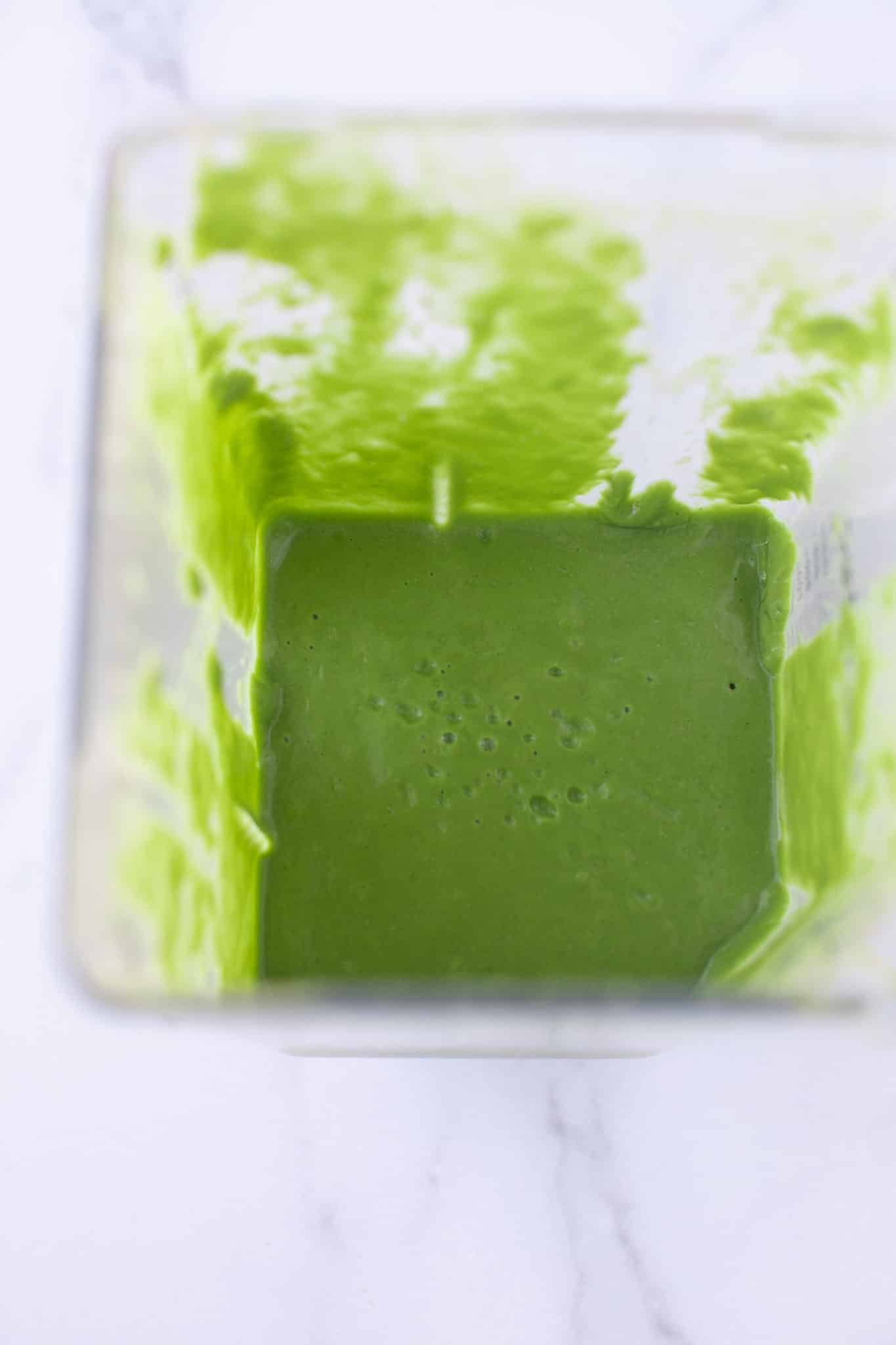 blended green smoothie ready for serving.