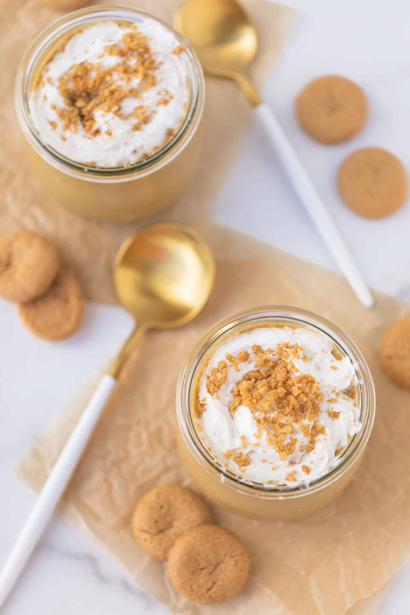 two gingerbread smoothies served in jars with gold spoons