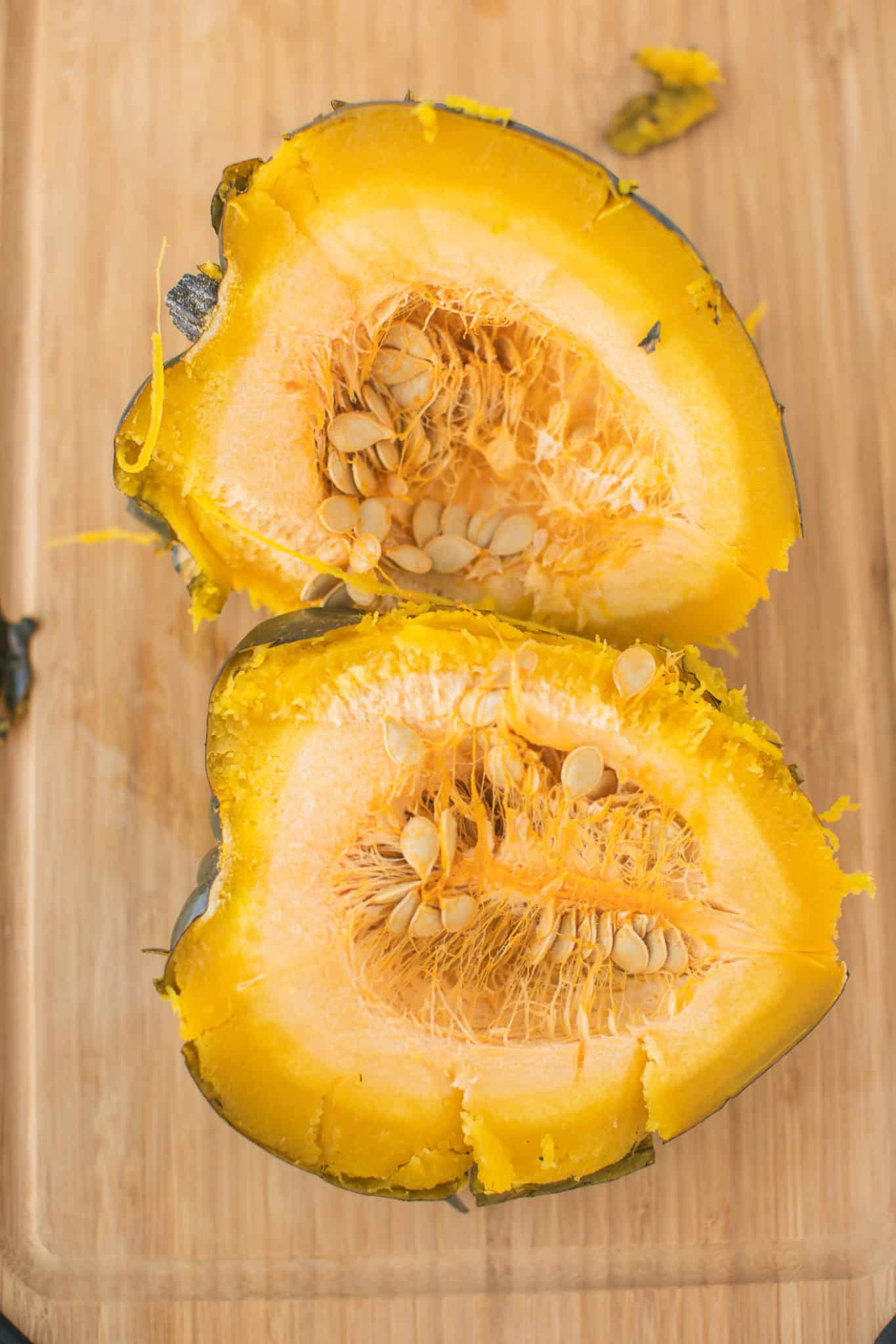 acorn squash cut in half with seeds.