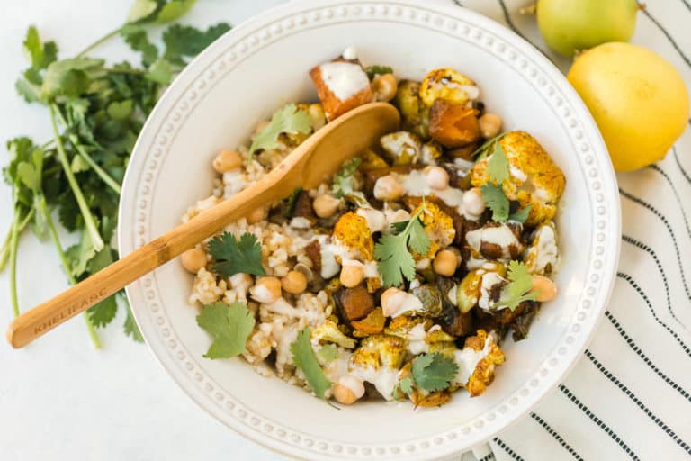 veggie bowl with a wooden spoon for serving