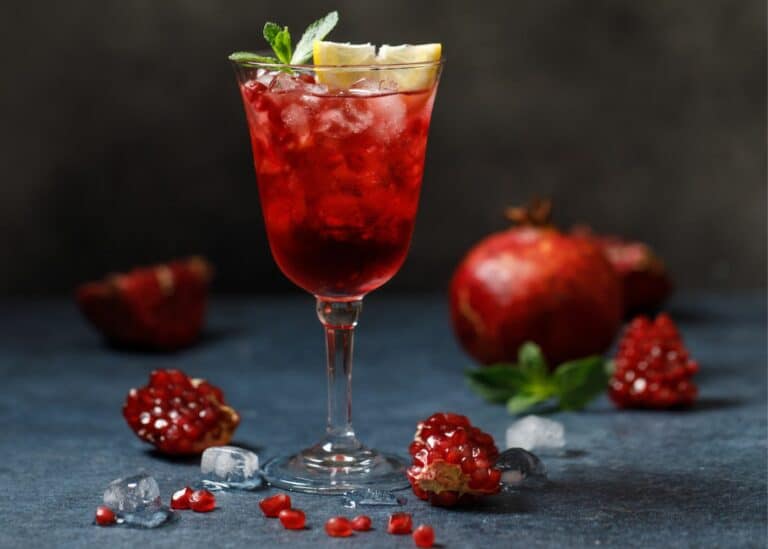 pomegranate mocktail in wine glass.