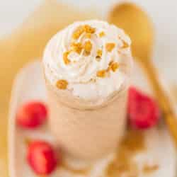 strawberry cheesecake smoothie served with whipped cream on top