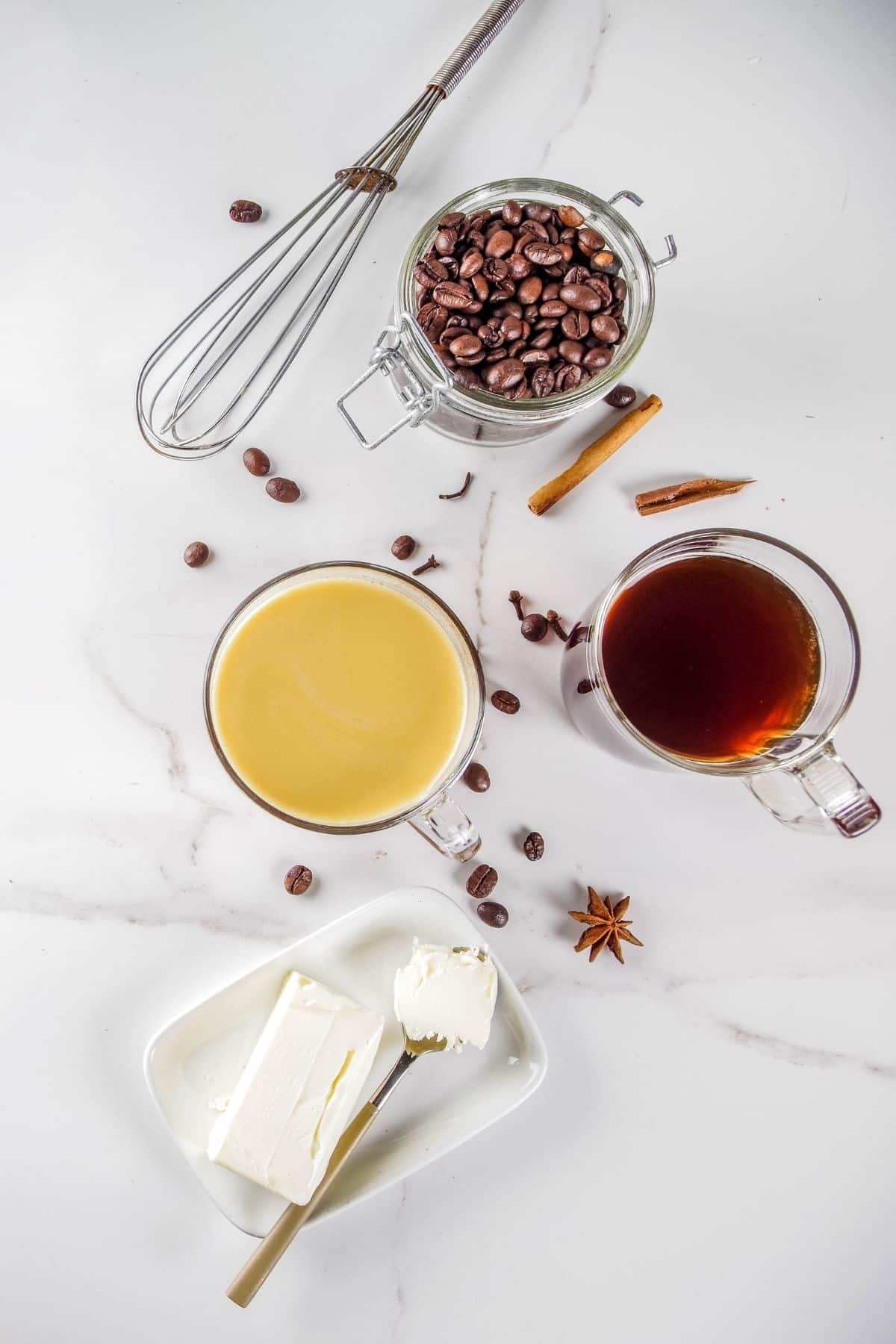 https://www.cleaneatingkitchen.com/wp-content/uploads/2020/12/butter-coffee-ingredients-on-a-countertop.jpg