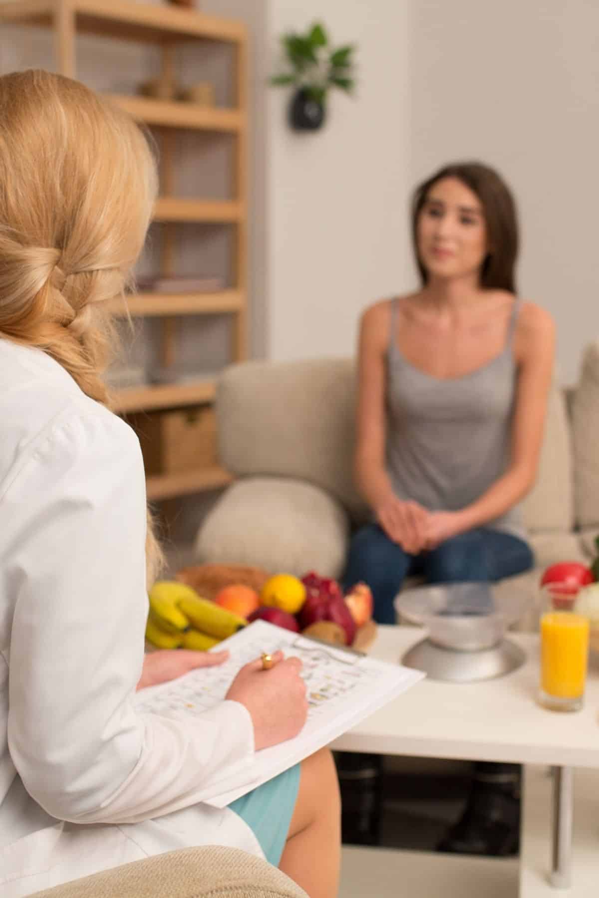 dietitian working with a young woman client.