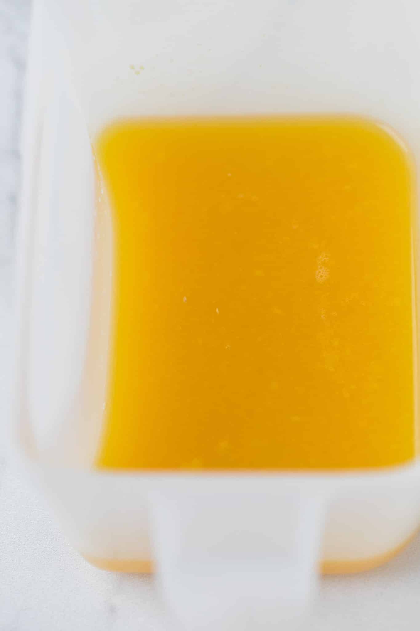 bright yellow juice after it has been juiced