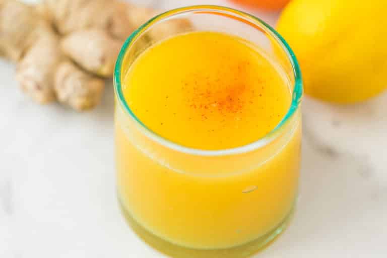 glass of ginger citrus immune boosting shot