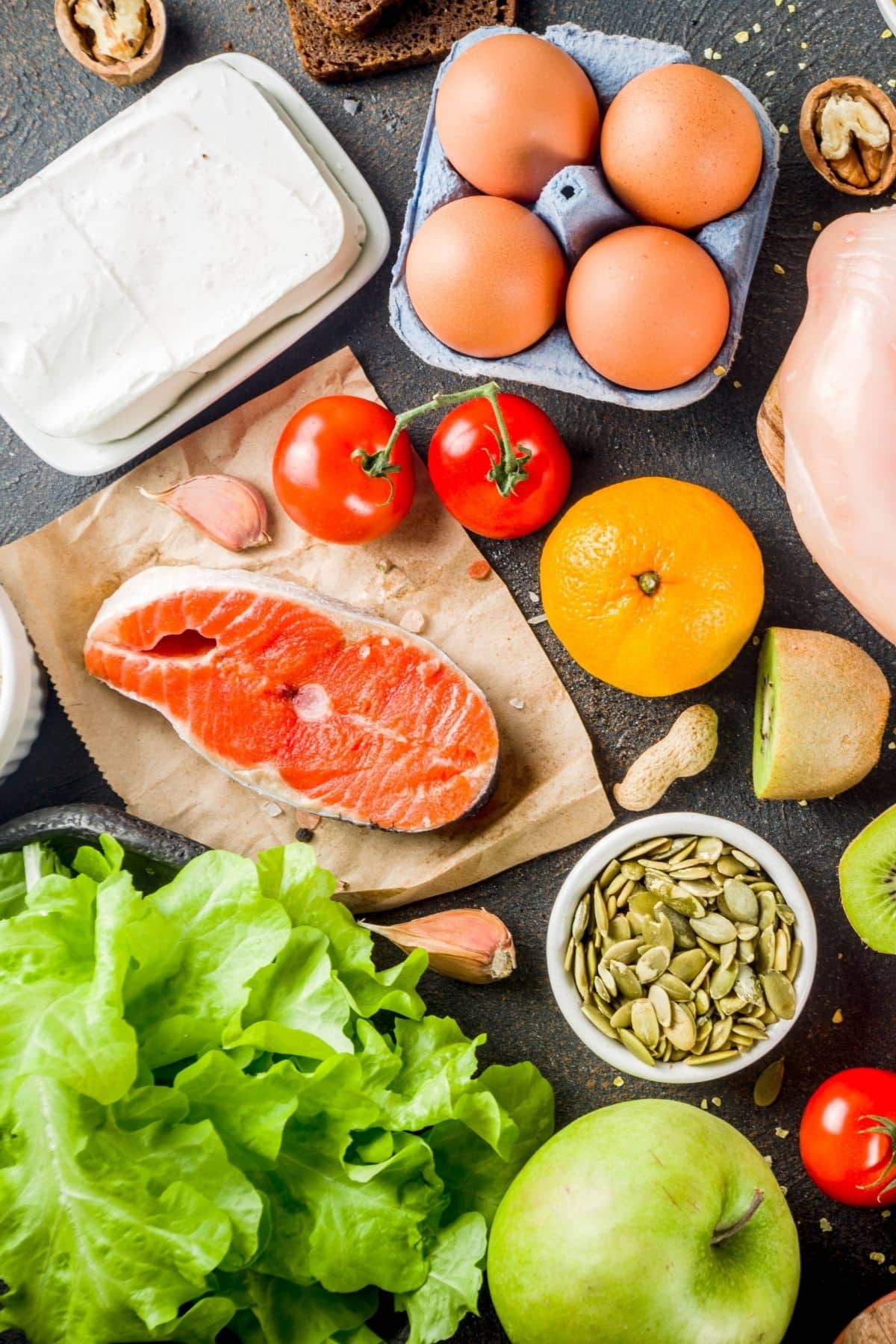 healthy foods including salmon and eggs on a tabletop