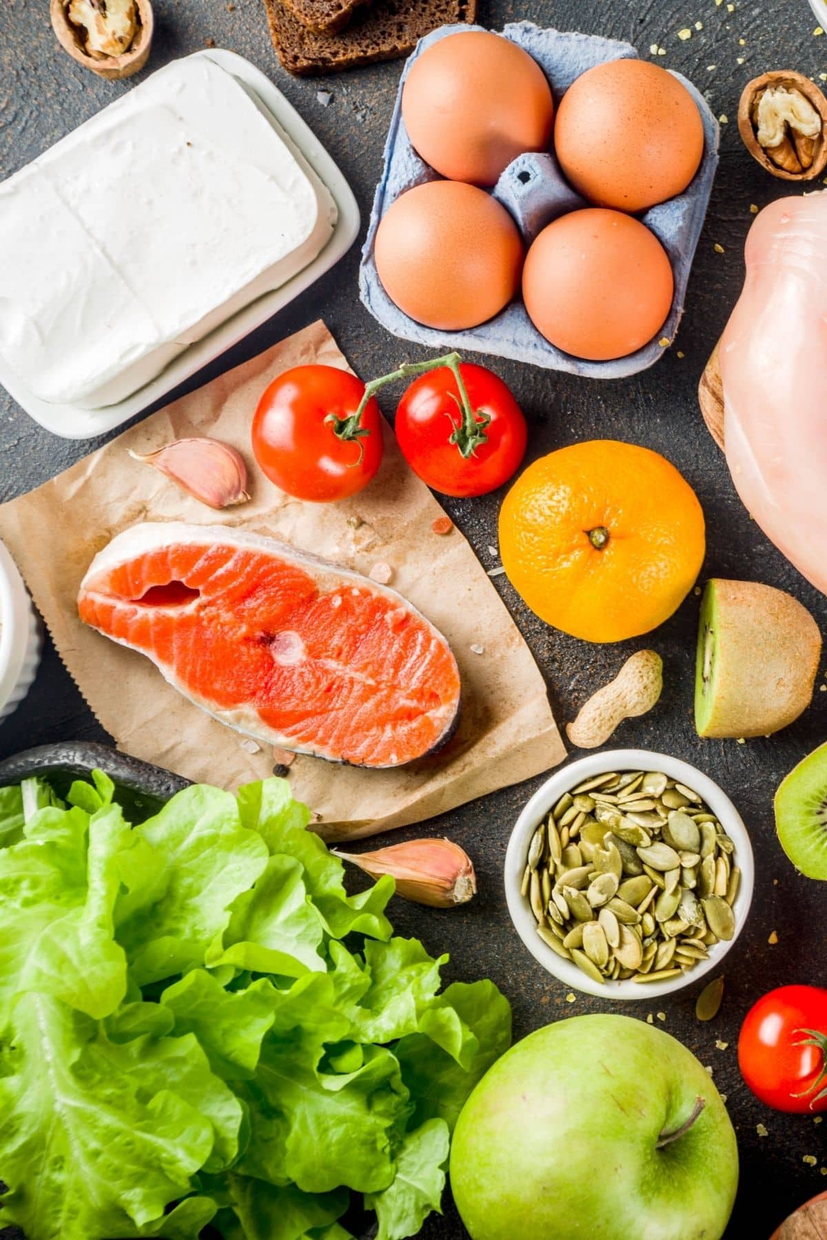 healthy foods including salmon and eggs on a tabletop.