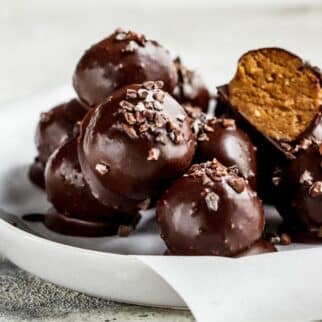 chocolate tahini truffles with cacao nibs on top.