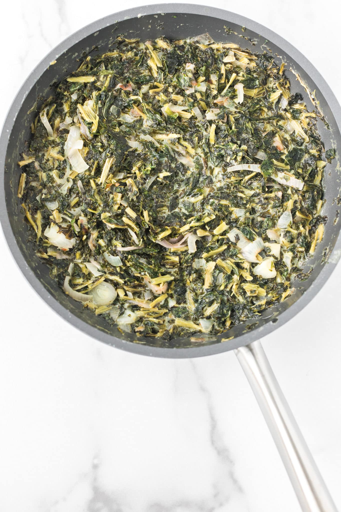 skillet with coconut creamed kale.