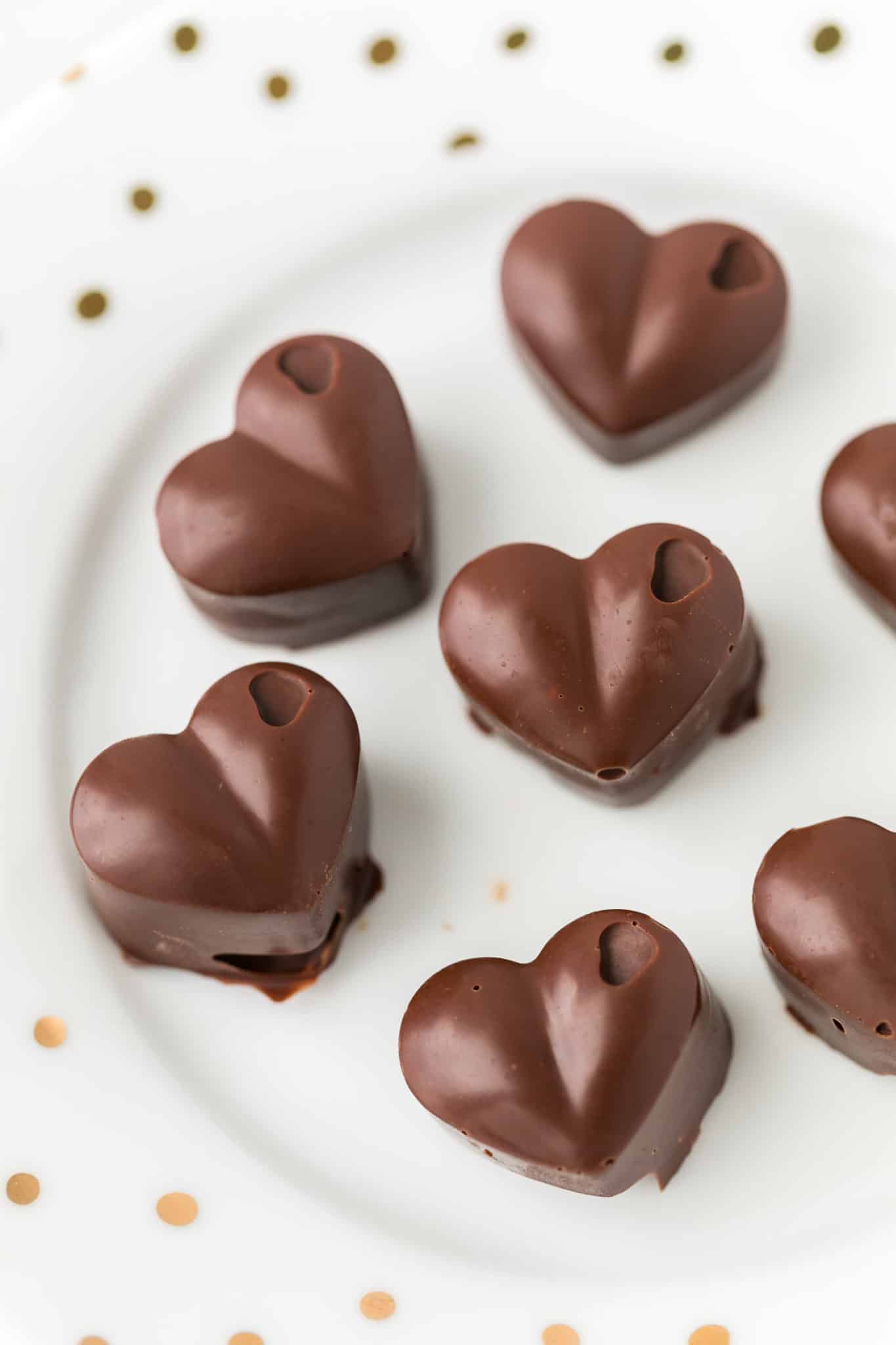 homemade chocolate hearts served on a white plate