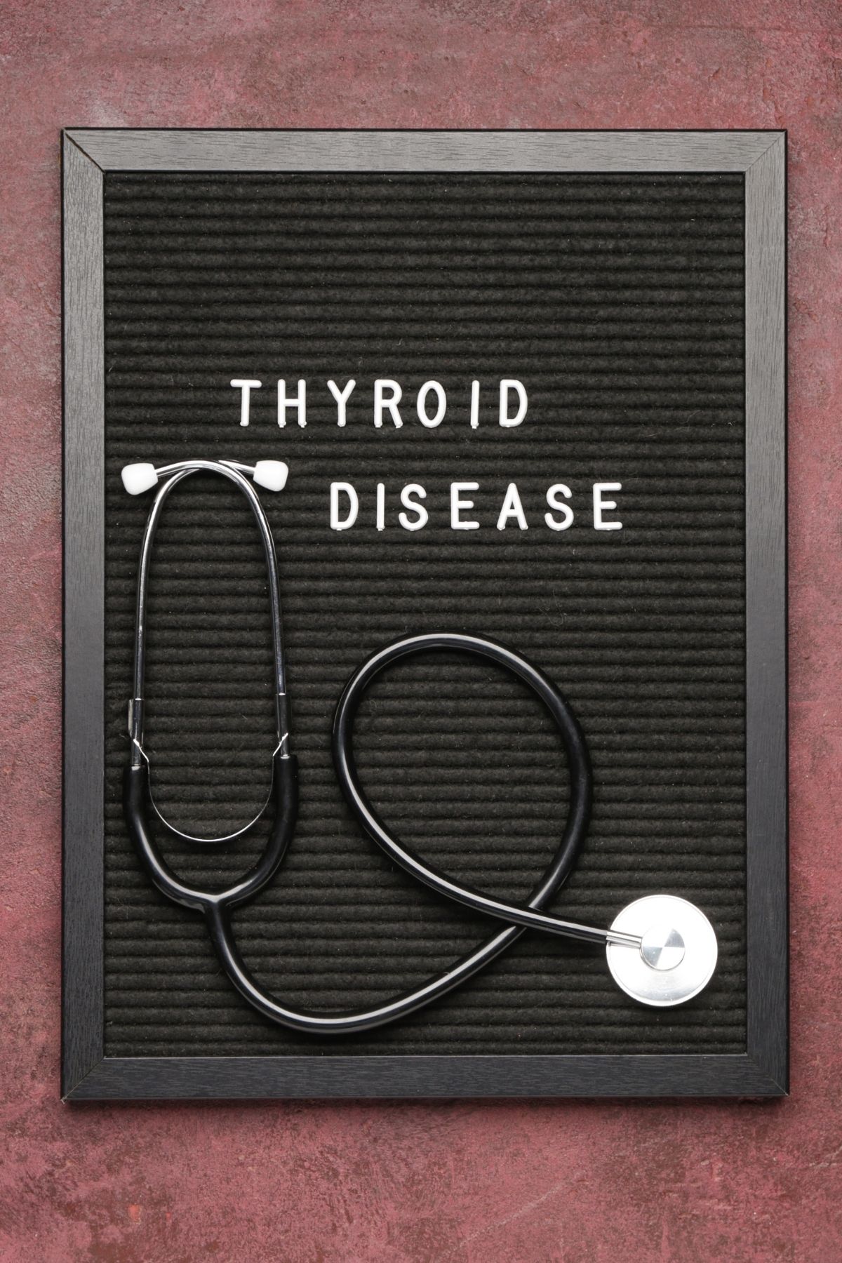 sign that says thyroid disease on it with a stethoscope