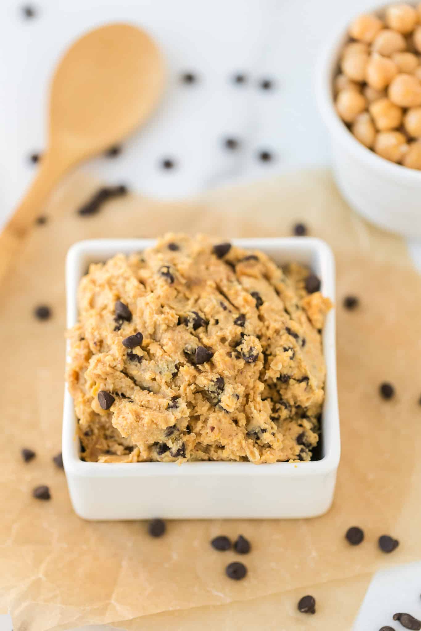 chickpea cookie dough served in a white square bowl.