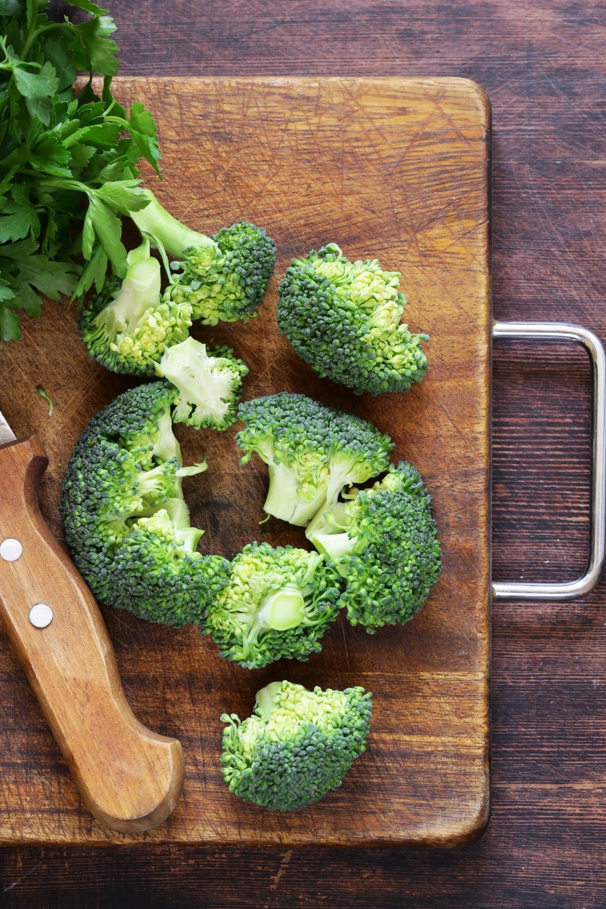 chopped broccoli on a cutting board.