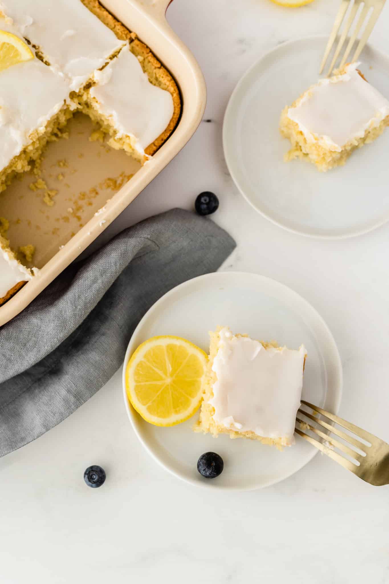 gluten free lemon cake served on white plates.