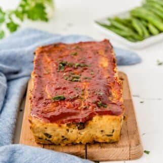 keto chicken meatloaf on cutting board.