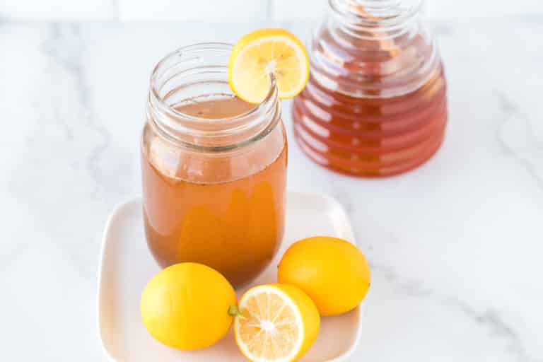 photo with a mug of lemon cinnamon water on a table
