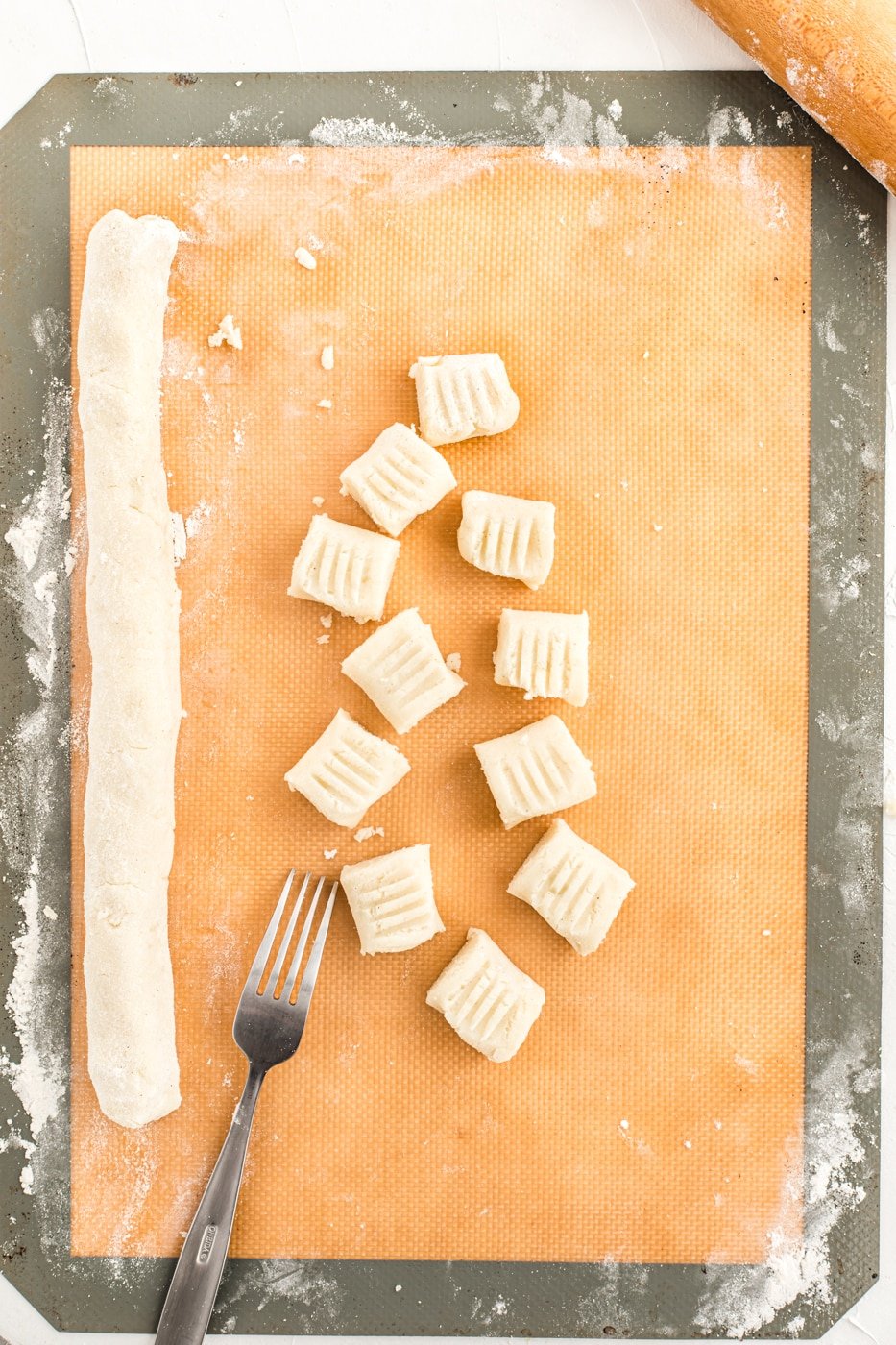 potato gluten-free gnocchi cut and marked with a fork.