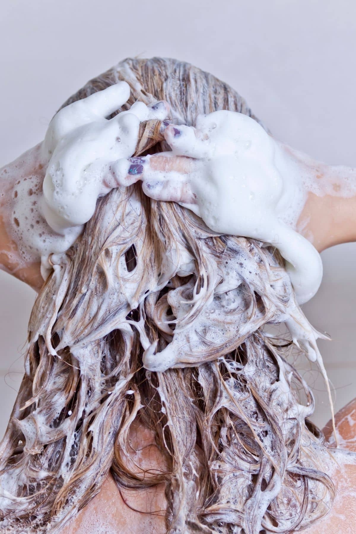 woman washing her hair.