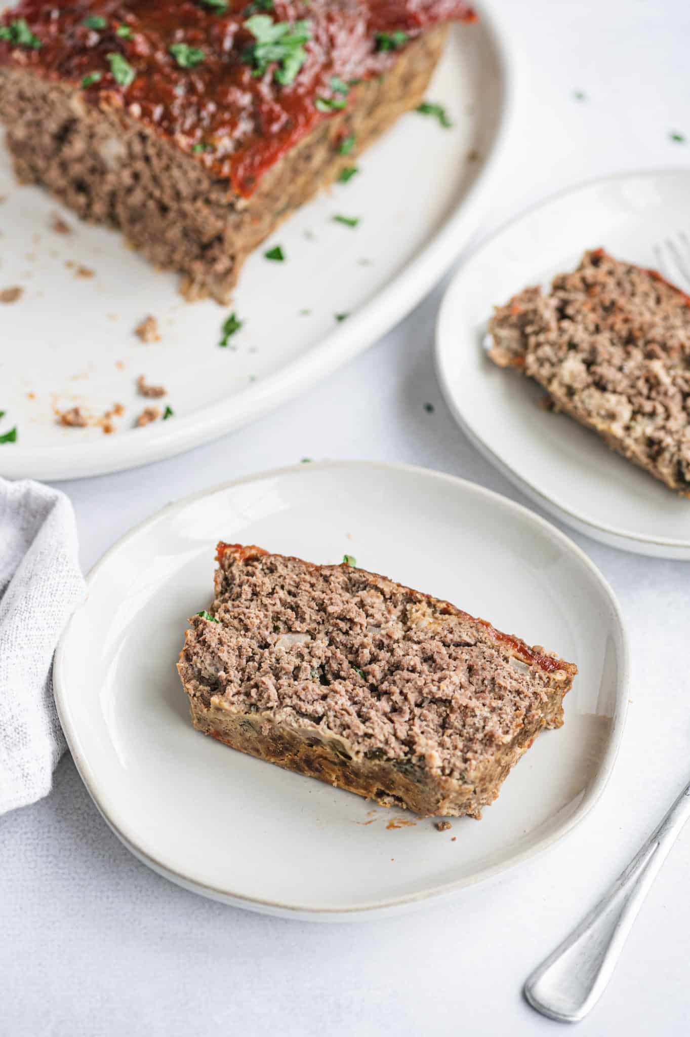 A slice of meatloaf on a plate