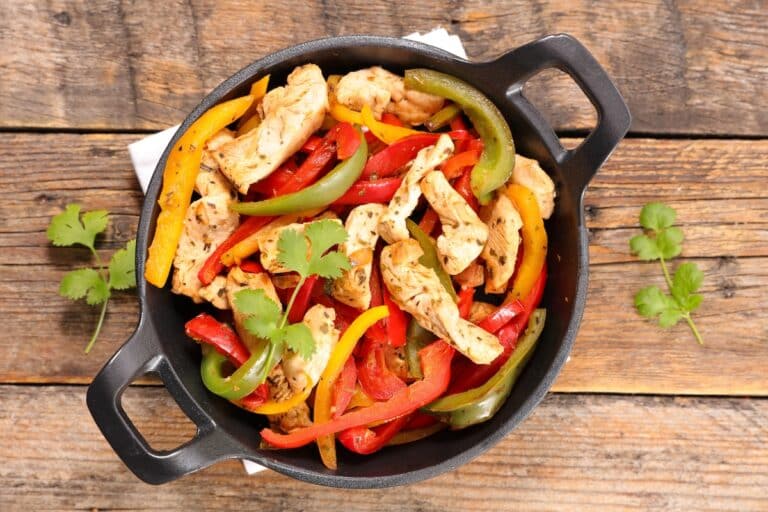 keto chicken fajitas served in cast iron skillet.