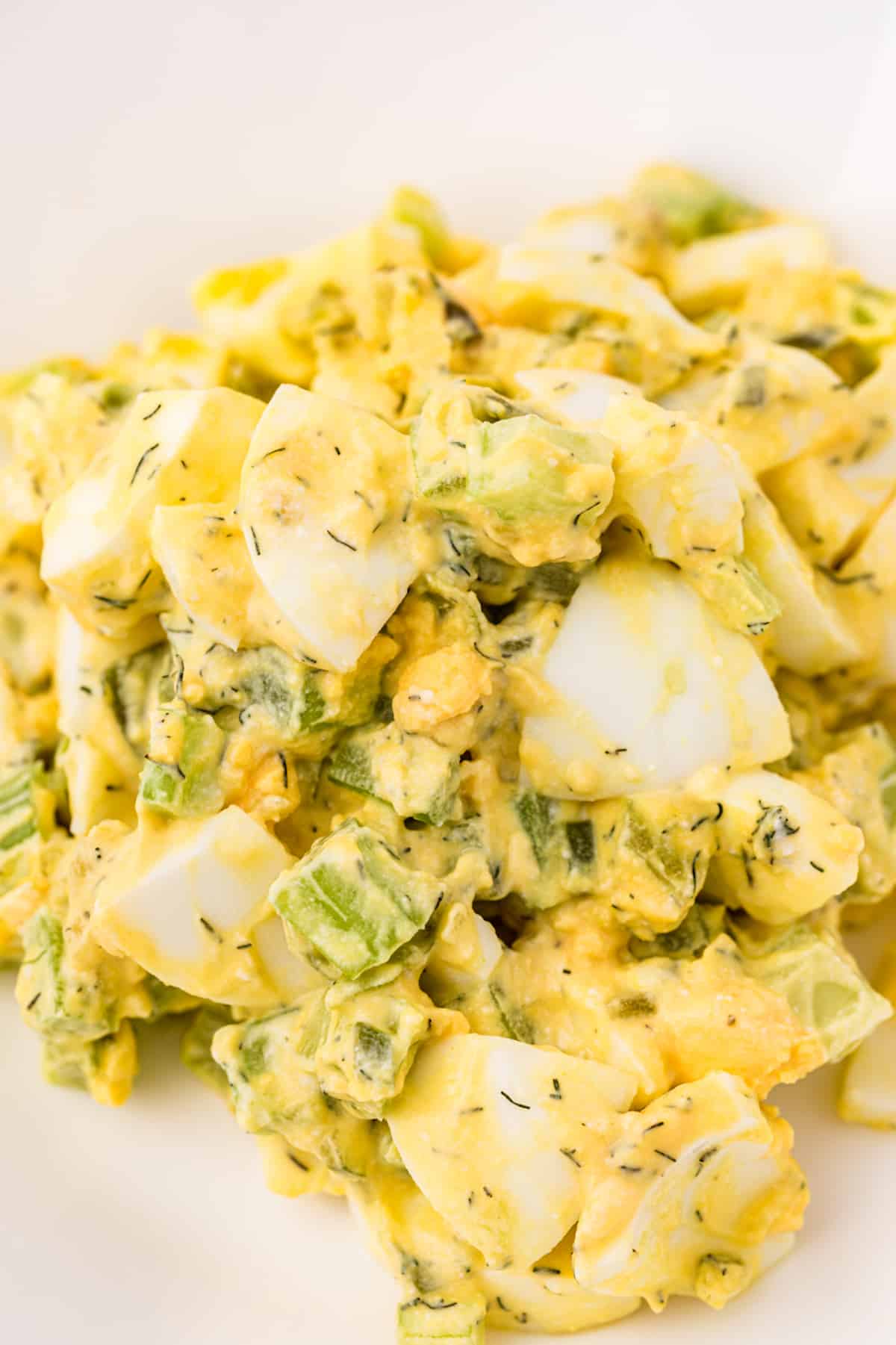 A close up of egg salad with greek yogurt.