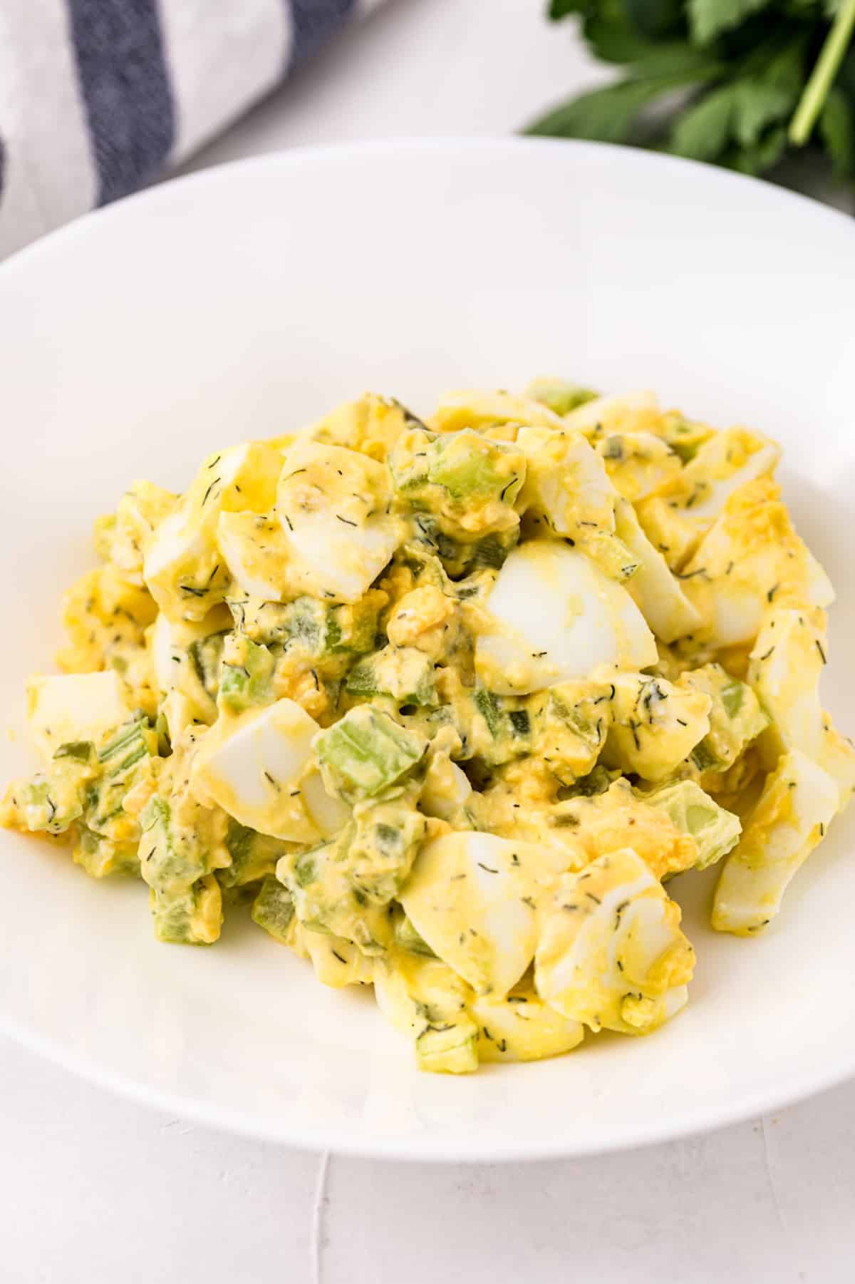 A plate of egg salad with celery.