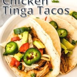 Chicken tinga taco with jalapenos and avocado