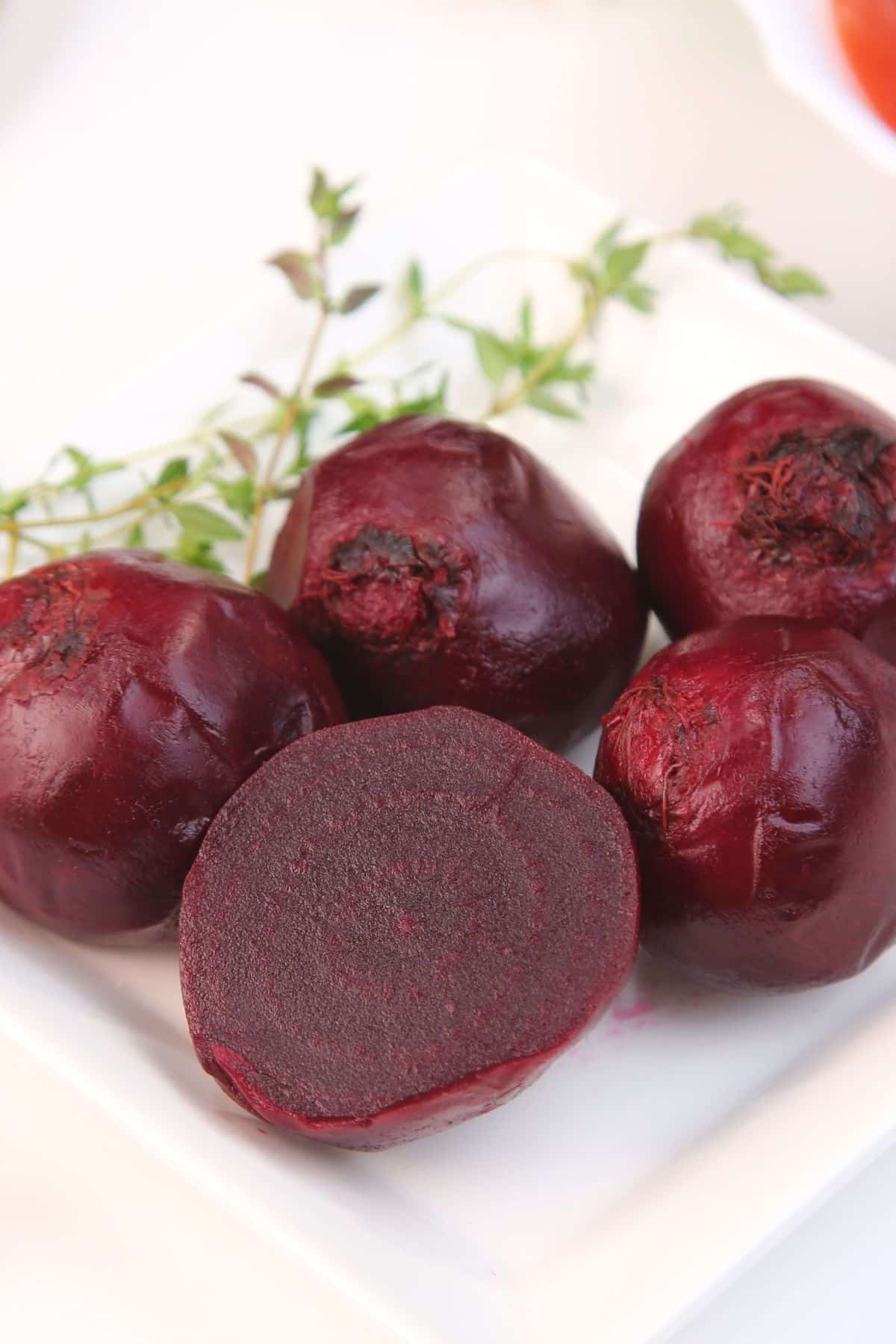 instant pot red beets served whole on a white plate