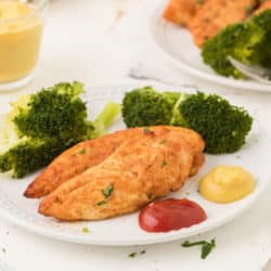 A plate of chicken with broccoli
