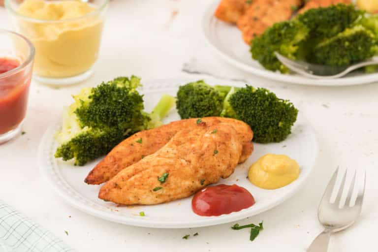 A plate of chicken with broccoli