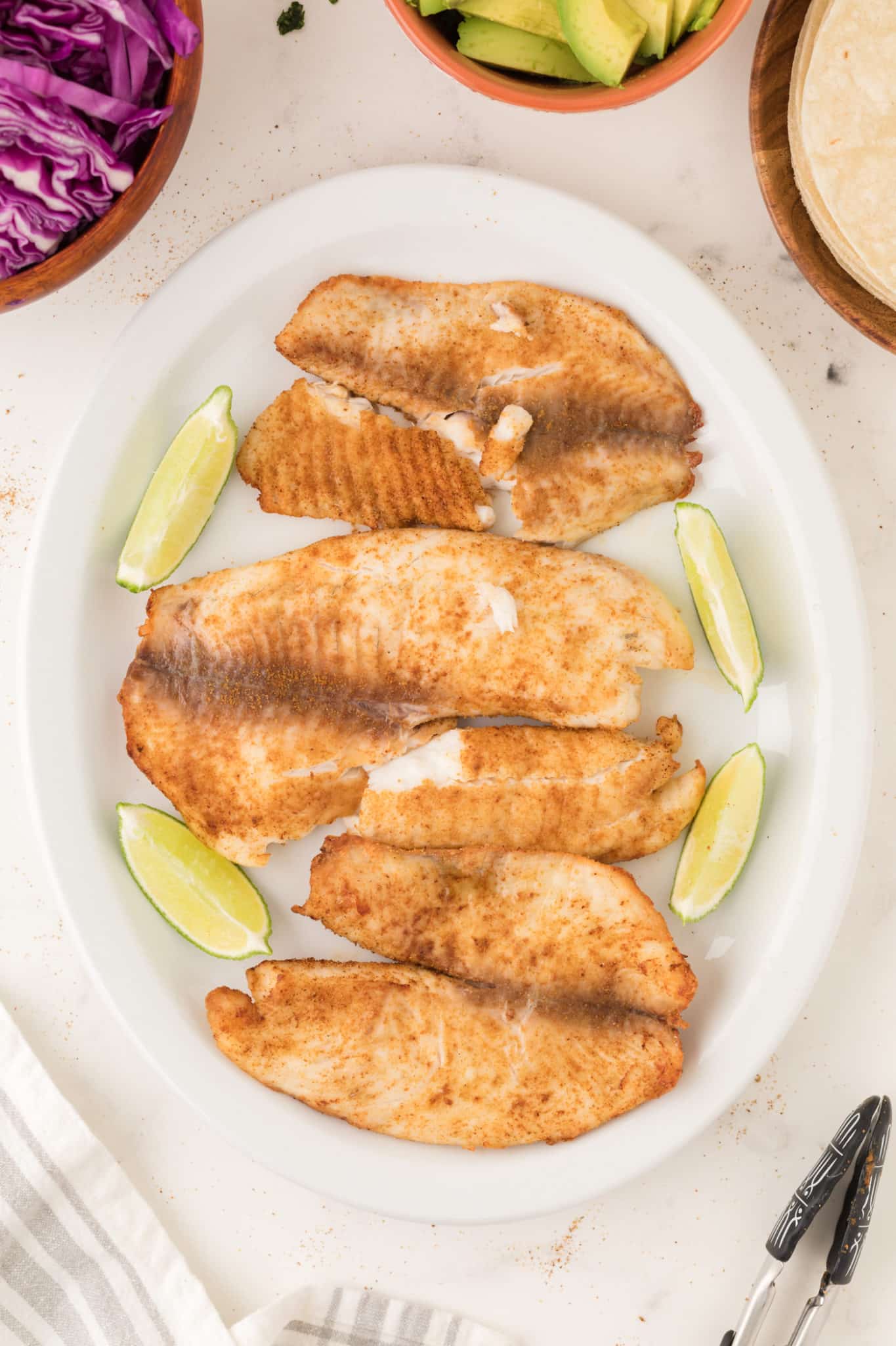 air fryer tilapia served on a plate.