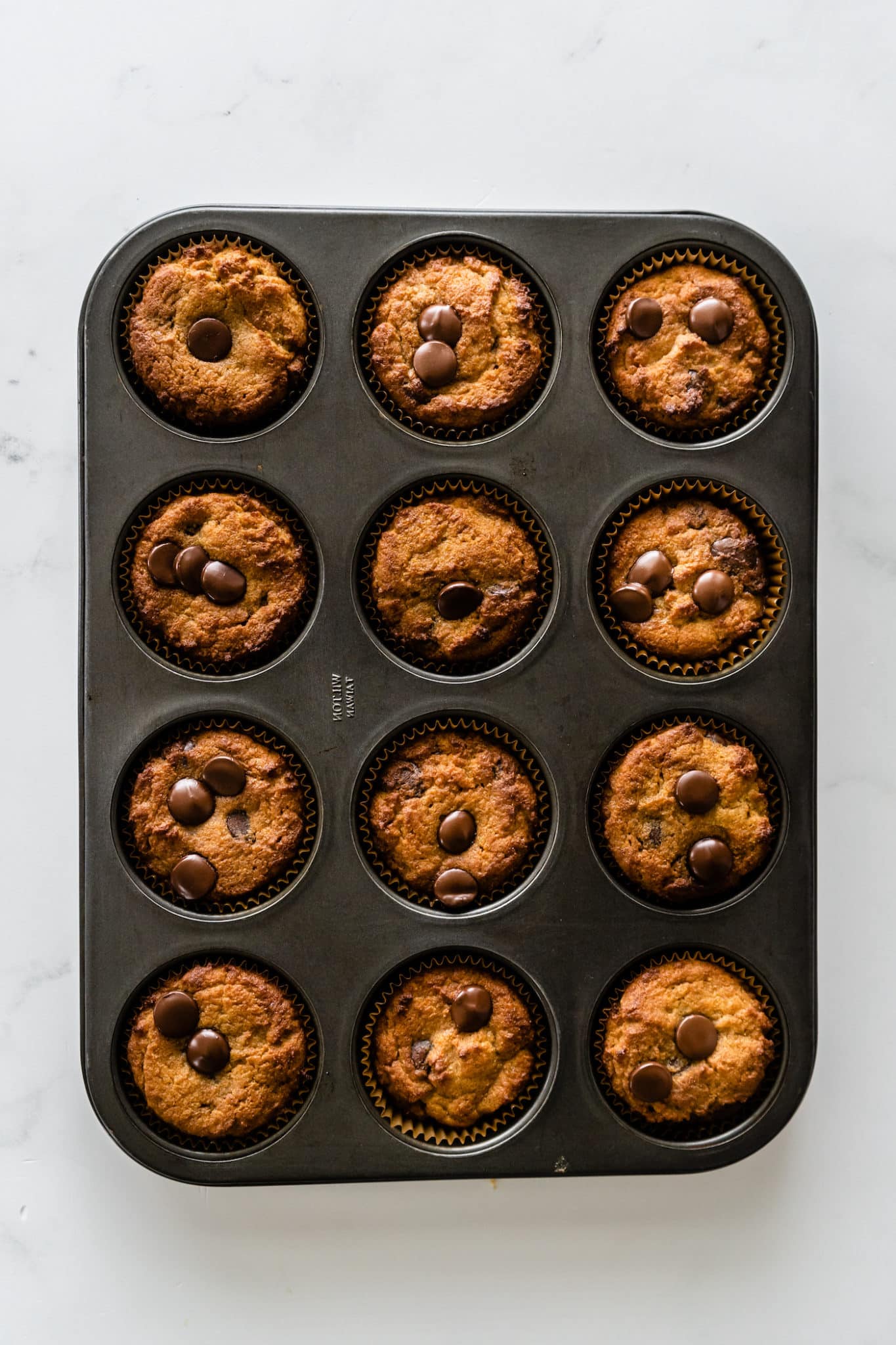 baked coconut flour muffins in muffin tin