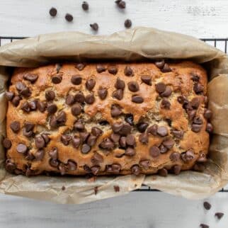 dairy free banana bread on cooling rack with chocolate chips.