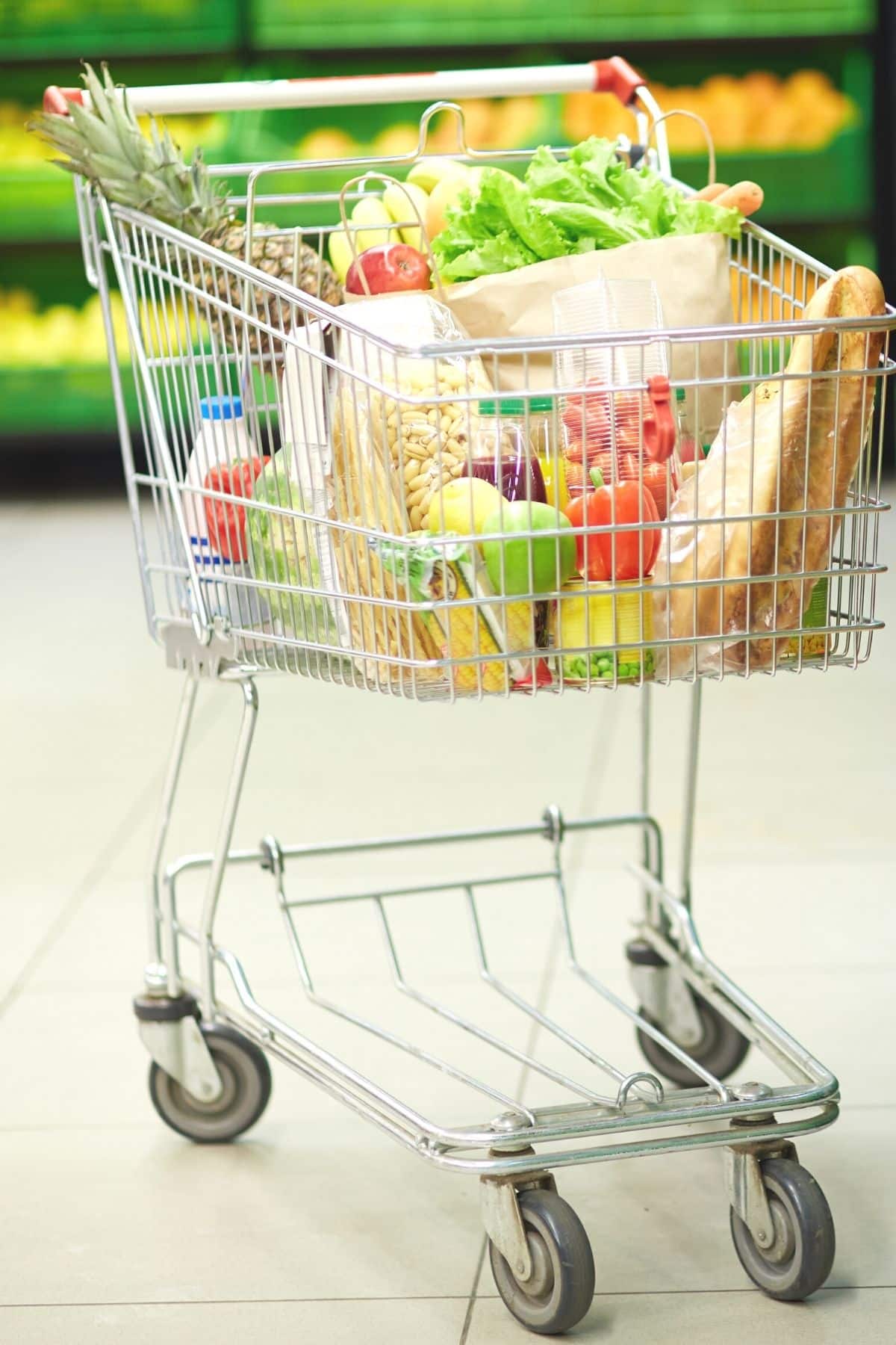 grocery cart filled with healthy foods