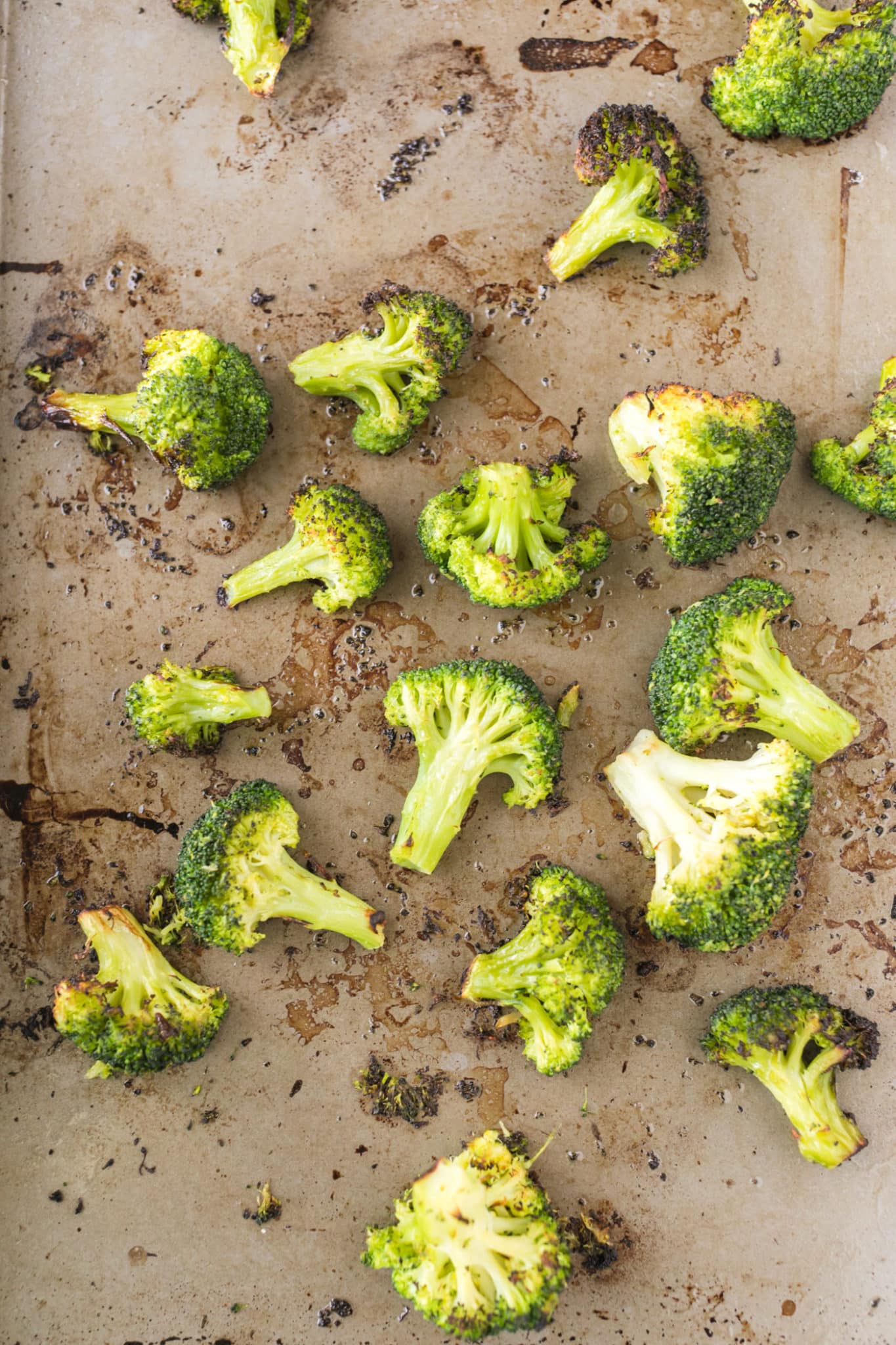 roasted broccoli florets on baking sheet.