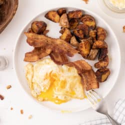 A plate of fried eggs and bacon