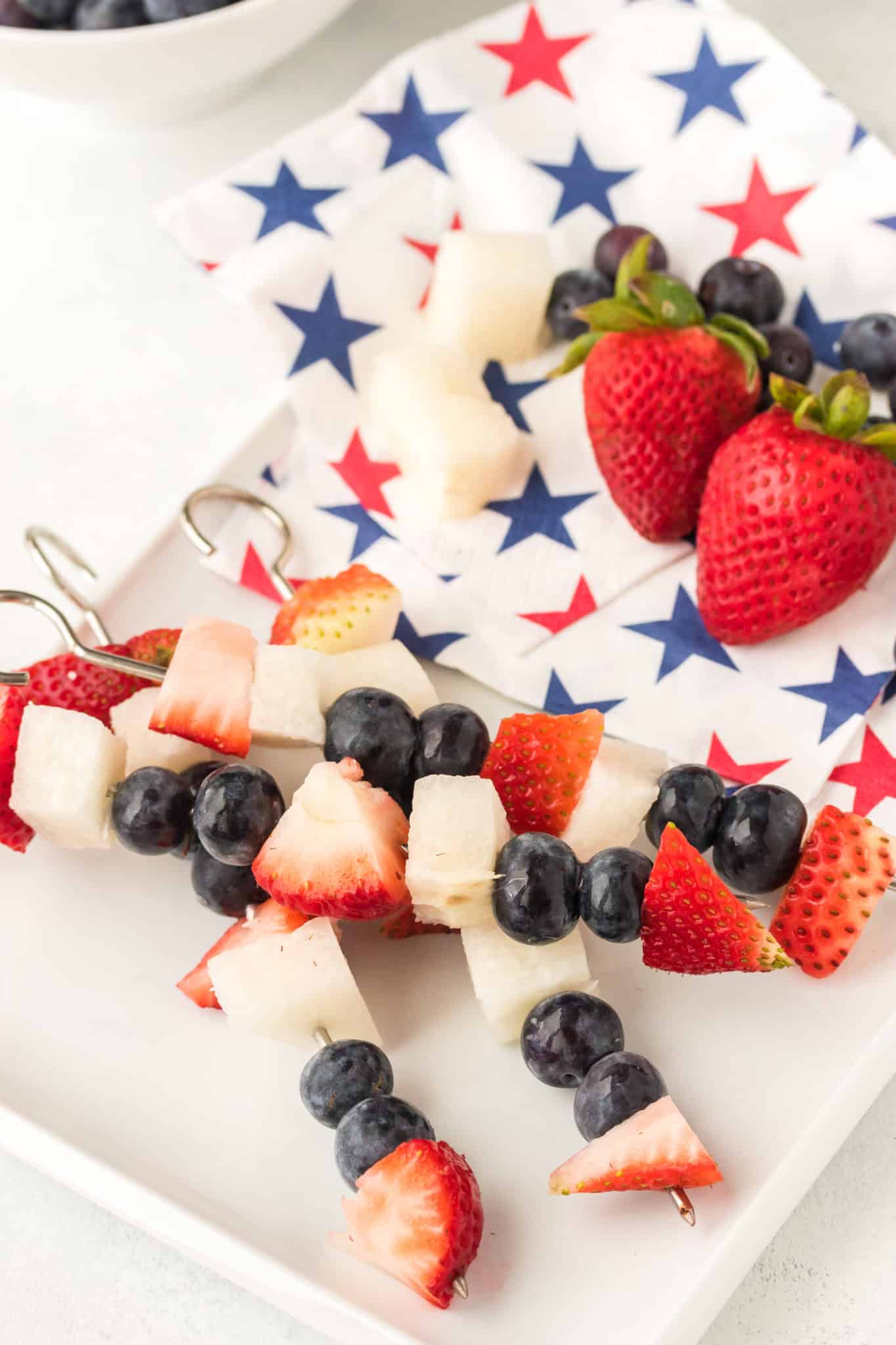 4th of july fruit kabobs with strawberries, blueberries, and jicama