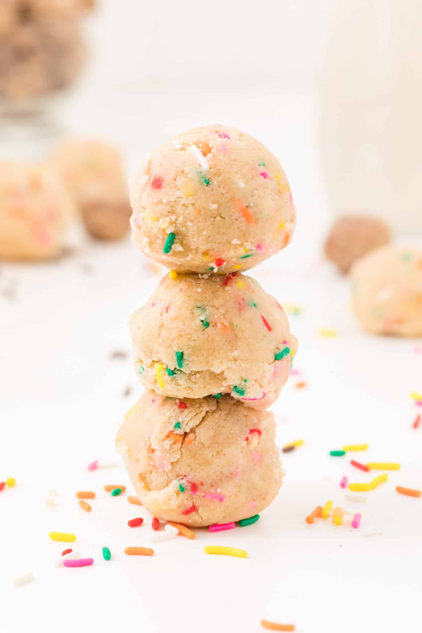 stack of three sugar cookie balls with sprinkles