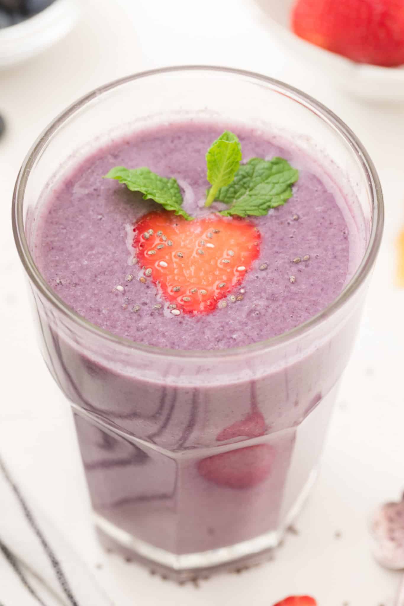 Strawberry and blueberry smoothie in a glass.
