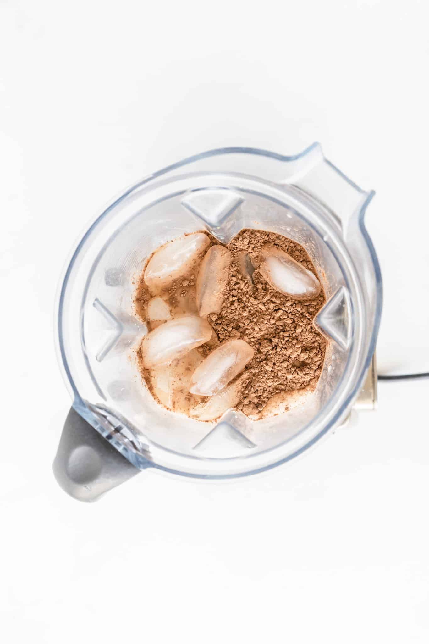Cocoa powder and ice in a blender