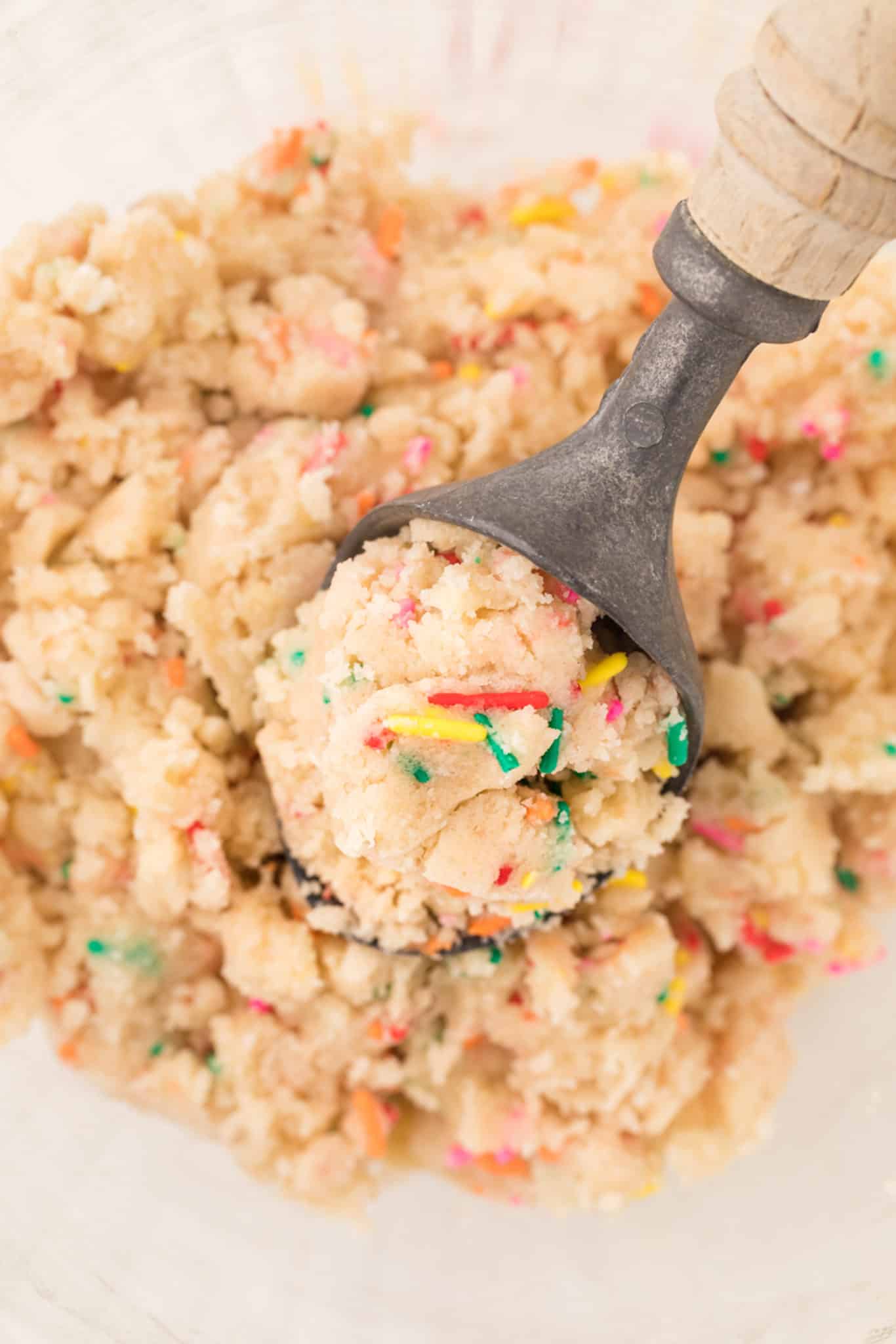 a scoop of edible sugar cookie dough with sprinkles