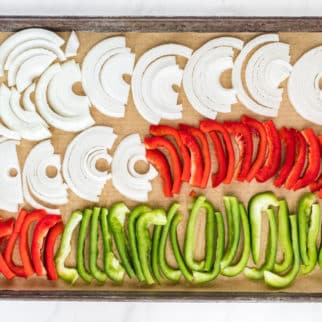 sheet pan of sliced peppers and onions